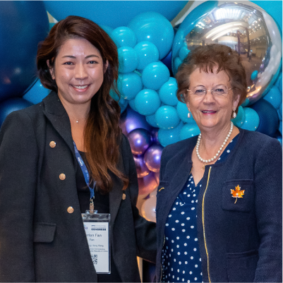 Myrian Fan and Liz Westcott at Congress 2026 in front of a balloon wall.