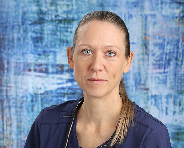 Tanya Arbour in her scrubs with a stethoscope. 