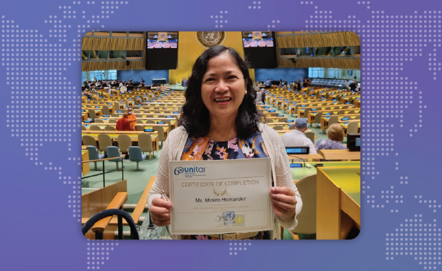 Monina Hernandez at the UN holding her certificate of completion.